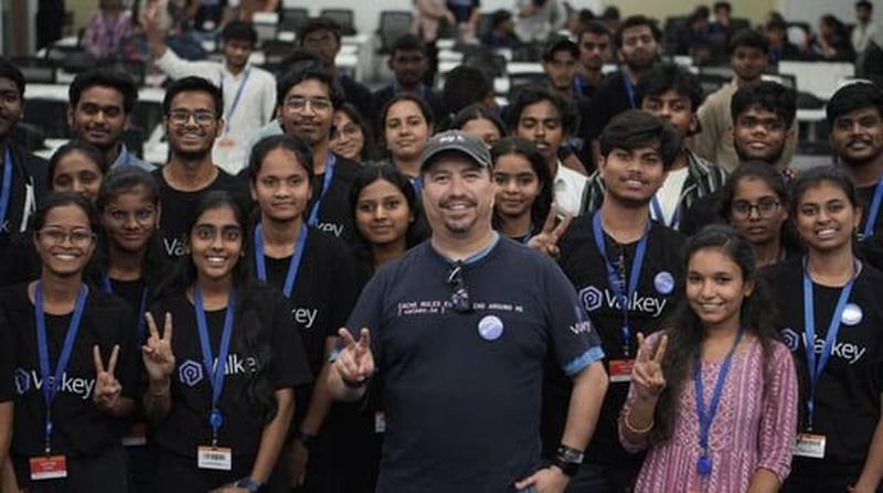Student contributors wearing Valkey shirts at a community event
